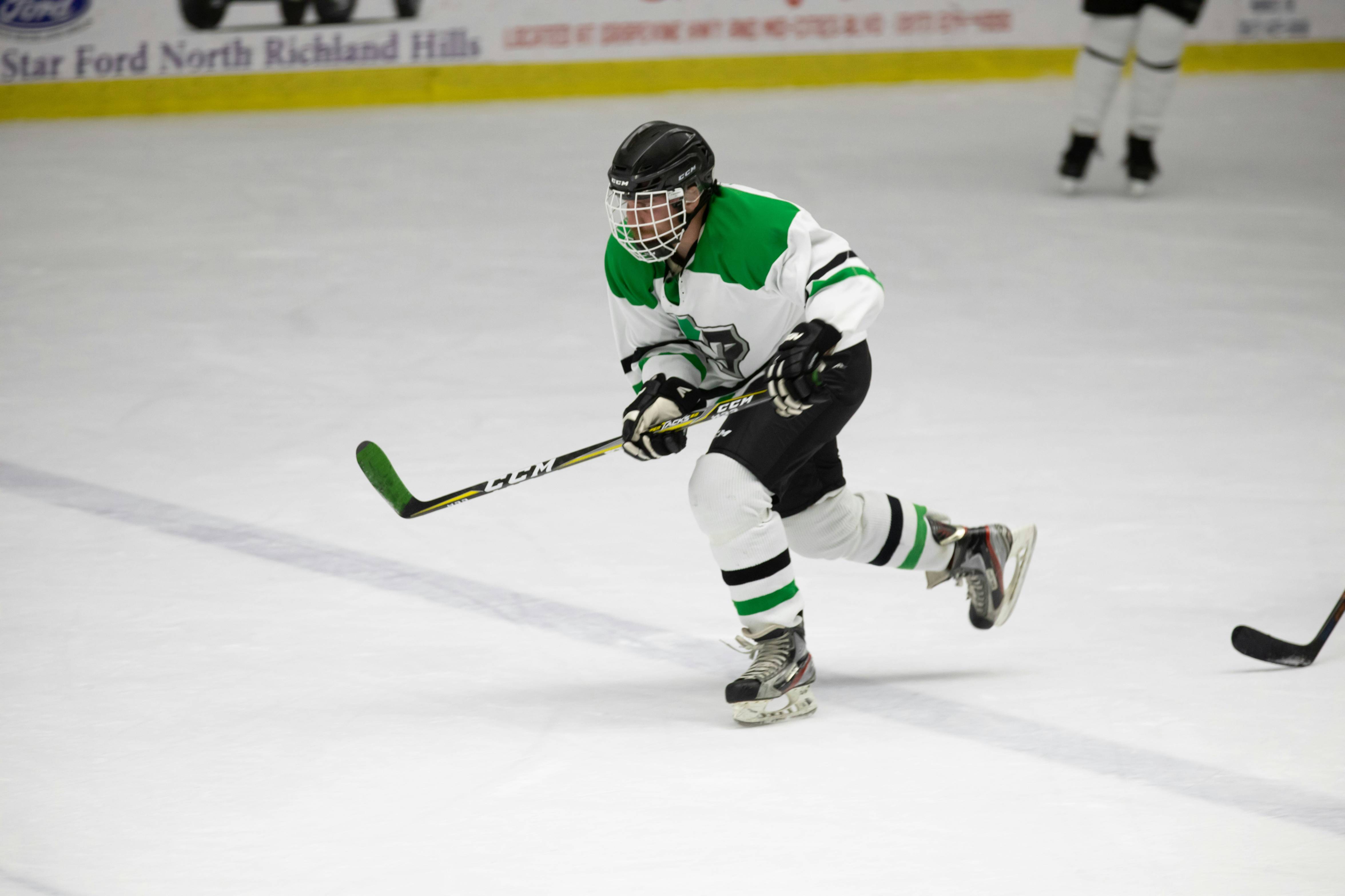 men playing ice hockey game