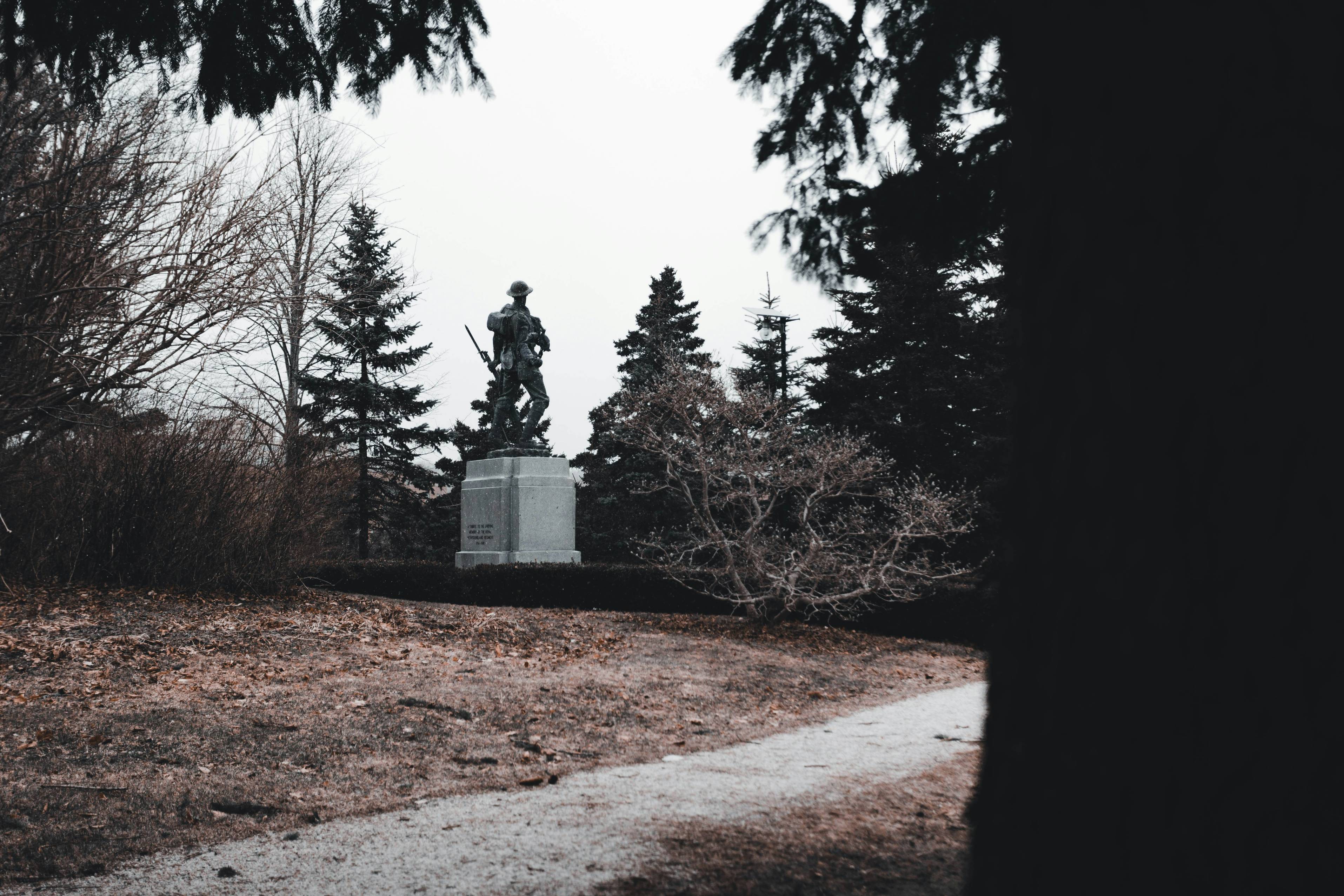 a statue in the middle of a park
